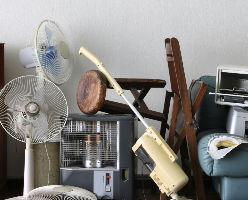 Image of a various furniture and household items in a pile to promote donating and decluttering