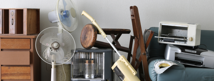 Image of a various furniture and household items in a pile to promote donating and decluttering